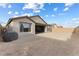 Spacious backyard with gravel landscaping, offering a blank canvas for your outdoor dreams at 10863 Gardenova Ave, Las Vegas, NV 89166