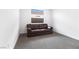 Bright bonus room with neutral carpet, white walls, and a comfortable brown leather sofa at 10863 Gardenova Ave, Las Vegas, NV 89166