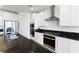 Well-equipped kitchen featuring stainless steel appliances, granite countertops, and ample cabinet space at 10863 Gardenova Ave, Las Vegas, NV 89166