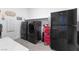 Well-equipped laundry room with modern appliances and ample storage space, ready for use at 10863 Gardenova Ave, Las Vegas, NV 89166