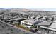 Aerial view of a modern home with a landscaped backyard and outdoor living spaces at 11015 Sanctuary Cove Ct, Las Vegas, NV 89135