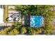 An aerial view showcases the backyard with a hot tub and surrounding landscaping at 11015 Sanctuary Cove Ct, Las Vegas, NV 89135
