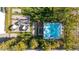 Aerial view of a backyard with a hot tub, seating area, and well-manicured landscaping at 11015 Sanctuary Cove Ct, Las Vegas, NV 89135