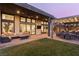 Large backyard with a covered patio, dining area and outdoor furniture at 11015 Sanctuary Cove Ct, Las Vegas, NV 89135