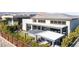 Contemporary home featuring a backyard with covered patios and outdoor seating areas at 11015 Sanctuary Cove Ct, Las Vegas, NV 89135