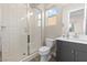 Bright bathroom featuring a glass enclosed shower with white tiled walls at 11015 Sanctuary Cove Ct, Las Vegas, NV 89135