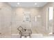 The primary bathroom features a glass enclosed shower with dual shower heads and bench seating at 11015 Sanctuary Cove Ct, Las Vegas, NV 89135