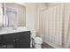 This bathroom features a shower and tub combination and modern vanity at 11015 Sanctuary Cove Ct, Las Vegas, NV 89135