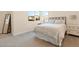Comfortable bedroom with large window, decorative mirror and carpeted flooring at 11015 Sanctuary Cove Ct, Las Vegas, NV 89135
