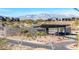 Mesa Ridge gated community entrance with stone architecture, landscaping, and mountain views at 11015 Sanctuary Cove Ct, Las Vegas, NV 89135