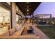 Open covered patio featuring an outdoor kitchen, lounge and dining area at 11015 Sanctuary Cove Ct, Las Vegas, NV 89135