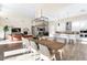 Dining area features a large table, kitchen with island, and open-concept living at 11015 Sanctuary Cove Ct, Las Vegas, NV 89135