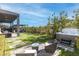 Relaxing backyard with a hot tub, outdoor seating, and professional landscaping at 11015 Sanctuary Cove Ct, Las Vegas, NV 89135