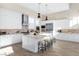 Modern kitchen features white cabinetry, stainless steel appliances, and a stylish kitchen island at 11015 Sanctuary Cove Ct, Las Vegas, NV 89135