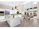 Bright kitchen with white cabinets, stainless steel appliances, and a large island at 11015 Sanctuary Cove Ct, Las Vegas, NV 89135