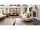Spacious living room with a fireplace, stylish furniture, and lots of natural light at 11015 Sanctuary Cove Ct, Las Vegas, NV 89135