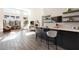 Spacious open-plan with modern living area featuring fireplace, bar, and large windows at 11015 Sanctuary Cove Ct, Las Vegas, NV 89135