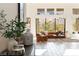 Bright living room with large windows, neutral color palette, and modern furnishings at 11015 Sanctuary Cove Ct, Las Vegas, NV 89135