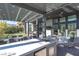 Outdoor kitchen area with grill, pergola, and seating, perfect for entertaining outdoors at 11015 Sanctuary Cove Ct, Las Vegas, NV 89135