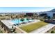 Community pool with lounge chairs, desert views, and manicured landscaping at 11015 Sanctuary Cove Ct, Las Vegas, NV 89135