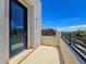 The balcony includes a wall mounted light fixture, an outlet, and great neighborhood views at 11739 Emerald Lake Ave, Las Vegas, NV 89138