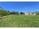 Beautiful green space at community park, with trees and buildings in the background at 11739 Emerald Lake Ave, Las Vegas, NV 89138