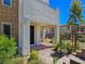 Inviting front entrance with stone accents, covered porch, and desert-friendly landscaping at 11739 Emerald Lake Ave, Las Vegas, NV 89138