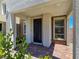 Covered front porch with stone accents, tiled flooring, and desert-friendly landscaping at 11739 Emerald Lake Ave, Las Vegas, NV 89138