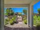 View from covered entrance shows desert landscaping and the property's architectural design at 11739 Emerald Lake Ave, Las Vegas, NV 89138