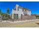 Contemporary two-story home with a modern design, low-maintenance landscaping, and mountain views in background at 11739 Emerald Lake Ave, Las Vegas, NV 89138