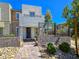 Charming two-story home featuring a modern design, inviting entryway, and well-maintained landscaping at 11739 Emerald Lake Ave, Las Vegas, NV 89138
