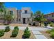 Inviting two-story home featuring desert landscaping, modern architectural details, and a welcoming entrance at 11739 Emerald Lake Ave, Las Vegas, NV 89138