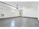 Spacious garage featuring sealed concrete floors, EV charger, and water heater at 11739 Emerald Lake Ave, Las Vegas, NV 89138