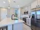 Modern kitchen featuring stainless steel appliances, ample cabinetry, and quartz countertops at 11739 Emerald Lake Ave, Las Vegas, NV 89138