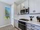 Contemporary kitchen with stainless appliances, gas range, and herringbone backsplash at 11739 Emerald Lake Ave, Las Vegas, NV 89138