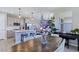 Bright kitchen featuring stainless appliances, white cabinets, and pendant lighting over the island at 11739 Emerald Lake Ave, Las Vegas, NV 89138