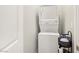 Conveniently located stacked washer and dryer unit with storage in a laundry area at 11739 Emerald Lake Ave, Las Vegas, NV 89138
