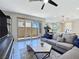 Bright living room with access to a private patio area through sliding glass doors at 11739 Emerald Lake Ave, Las Vegas, NV 89138