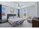 The spacious main bedroom has a sitting area, ceiling fan, and access to an outdoor patio at 11739 Emerald Lake Ave, Las Vegas, NV 89138