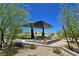 Stylish park structure with bench seating, enhanced with desert landscaping and mountain views at 11739 Emerald Lake Ave, Las Vegas, NV 89138