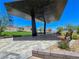 Modern park structure with desert landscaping and benches creating an inviting space at 11739 Emerald Lake Ave, Las Vegas, NV 89138