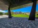 Modern shaded park structure with benches and views of the lush green space at 11739 Emerald Lake Ave, Las Vegas, NV 89138