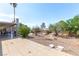 Tile-covered backyard patio with desert landscaping, and mature landscaping at 120 W Highland Dr, Henderson, NV 89015