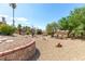Backyard featuring desert landscaping with mature trees and shrubs at 120 W Highland Dr, Henderson, NV 89015
