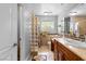 Bathroom featuring a unique window design, vanity, and tile flooring at 120 W Highland Dr, Henderson, NV 89015