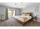 Bedroom with carpet, accent light, and sliding glass doors at 120 W Highland Dr, Henderson, NV 89015