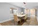 Dining room featuring a farmhouse-style table, modern light fixture and plenty of natural light at 120 W Highland Dr, Henderson, NV 89015
