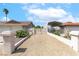 Gated desert landscaped driveway leading to attached garage and carport at 120 W Highland Dr, Henderson, NV 89015