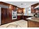 Gourmet kitchen with custom wood cabinets and stainless steel appliances at 120 W Highland Dr, Henderson, NV 89015