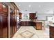 Spacious kitchen with custom wood cabinets, stainless appliances, and eat in dining at 120 W Highland Dr, Henderson, NV 89015